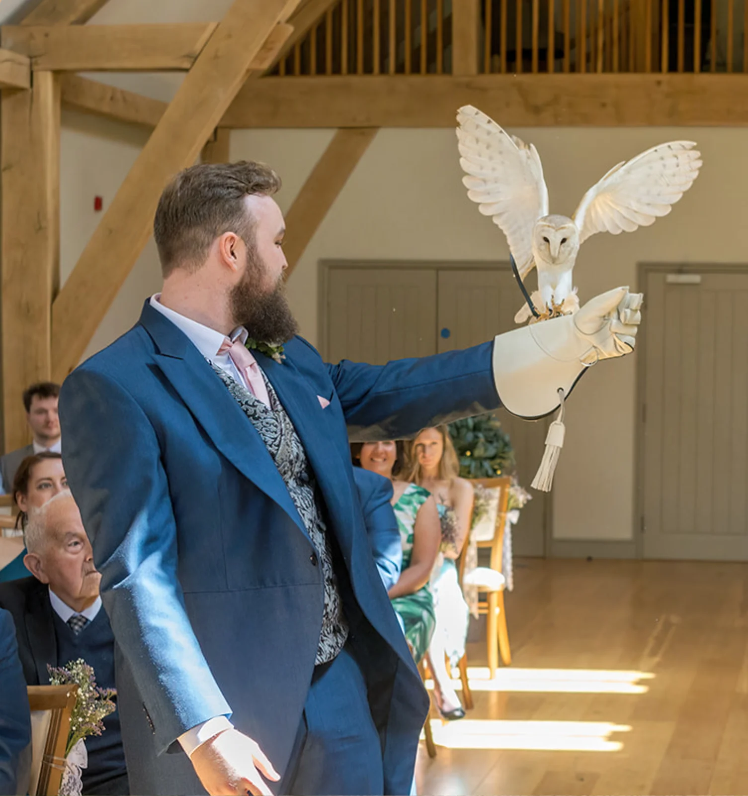barn-owl-ring-bearer-easton-grange-wedding-suffolk Juliet the owl ring bearer flying to a white glove.